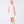 Load image into Gallery viewer, A structured white top with bow details and skirt duo