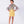 Load image into Gallery viewer, a bold floral blouse with bell sleeves, styled with a minimal yellow skirt