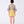 Load image into Gallery viewer, a bold floral blouse with bell sleeves, styled with a yellow skirt