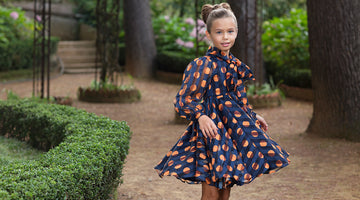navy dress with orange polka dots