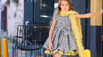 black and white checkered dress with a bow on the waist