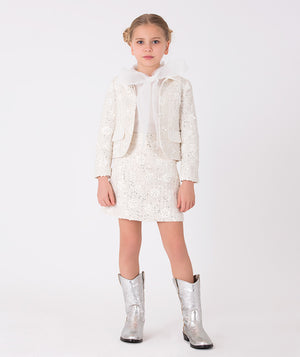 Ivory tweed jacket adorned with sequins and a stylish bow accent