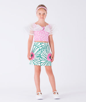 breezy blouse and vibrant leaf-print skirt