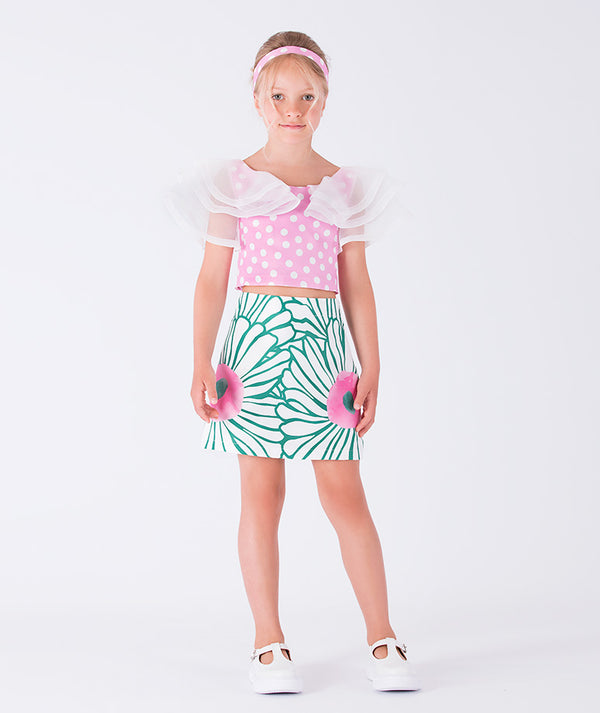 breezy blouse and vibrant leaf-print skirt