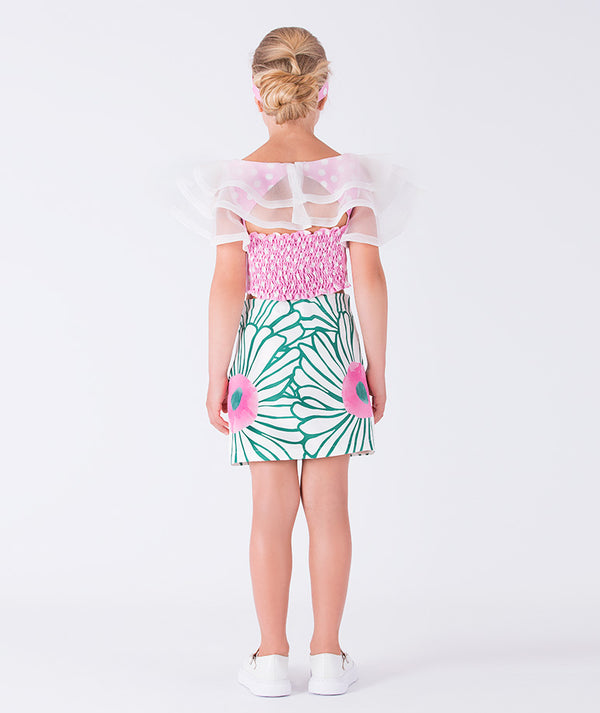 pink polka dotted blouse with organza details and green floral skirt