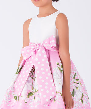 dress with white top and pink skirt that has flower prints and a big polka dotted bow on the waist