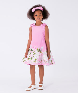 pink dress with floral prints and bow on the shoulders