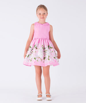 pink dress with peter pan collar and white flower prints on the skirt