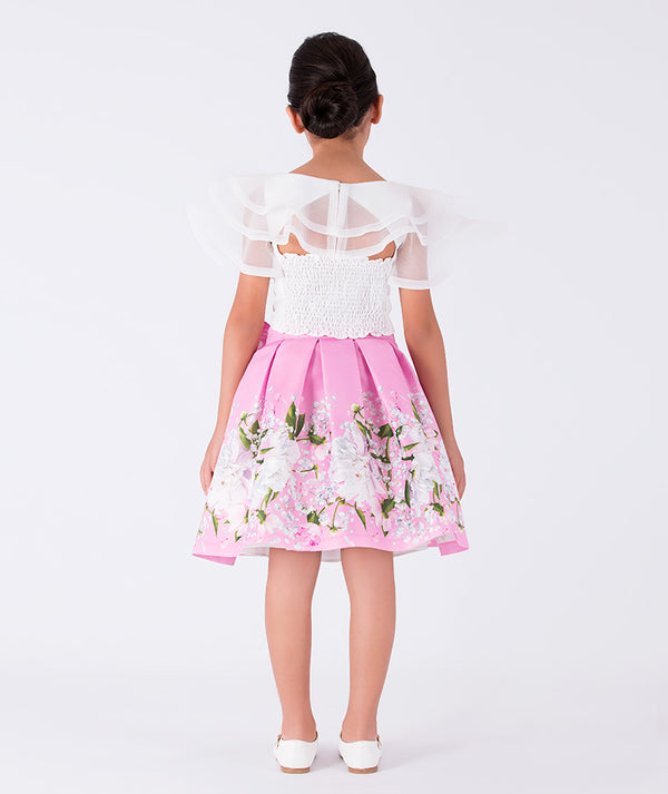 chic white organza ruffled blouse with a pink floral skirt