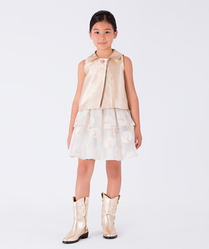 Shimmering gold top paired with a layered ivory organza skirt