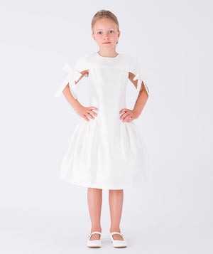 Elegant white dress featuring statement bow accents on the shoulders and a flared silhouette