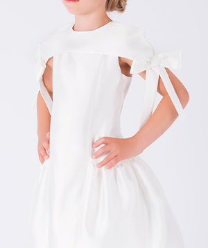 Elegant white dress featuring statement bow accents on the shoulders 
