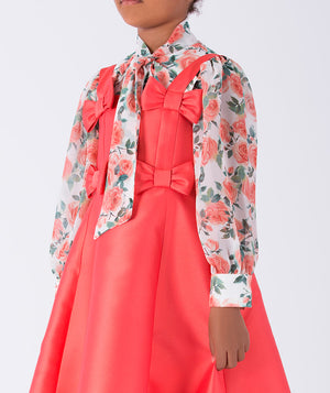 Vibrant coral dress with bow details and a floral printed long sleeved blouse