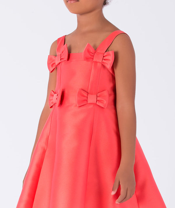 sleeveless, vibrant coral A-line dress with chic bow details