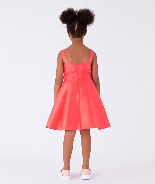 A sleeveless, vibrant coral A-line dress 