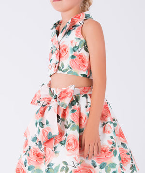 halter-neck floral blouse and matching skirt with a big bow on the waist