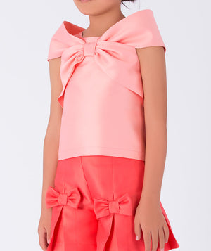 cute pink bow top and a coral skirt with bow details