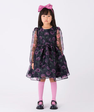 Floral-print dress with sheer organza sleeves, a layered skirt, and delicate ruffles. A magical dress designed to inspire twirls and spark imagination.