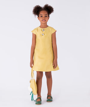 yellow dress with sparkling buttons