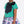 Load image into Gallery viewer, Kids fashion outfit featuring a floral skirt and green top with a navy bow
