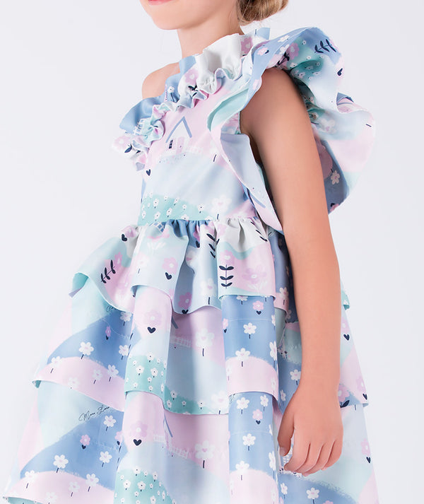 one-shoulder dress featuring cascading ruffles and a pastel countryside-inspired print