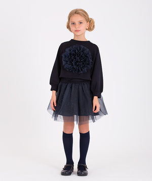 Girls' navy blue tulle skirt with glitter accents paired with a navy sweatshirt featuring a large floral applique