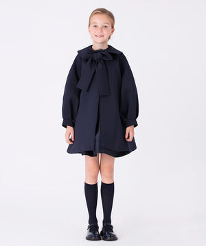 Navy jacket with puff sleeves and a statement bow on the front—perfect for adding a playful touch to any outfit.