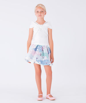 Elegant two-piece outfit featuring a crisp white blouse paired with a pastel-printed skirt