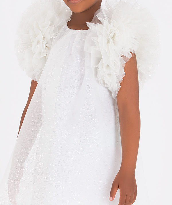 Charming girl's white party dress featuring voluminous ruffled sleeves and a delicate flowy design