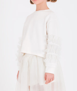 Elegant white outfit featuring a long-sleeve top with flower details and a flowing sheer skirt for girls