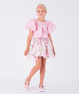 pink balloon sleeve blouse with a little bow and floral skirt