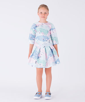 A charming two-piece outfit featuring a pastel printed top with three-quarter sleeves and a matching flared skirt