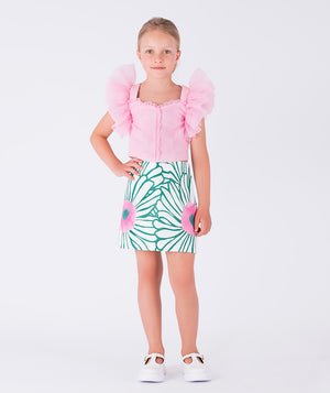 pastel pink blouse with floral skirt