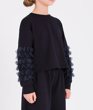 Stylish navy top with ruffle details on the sleeves paired with matching black wide-leg trousers for girls