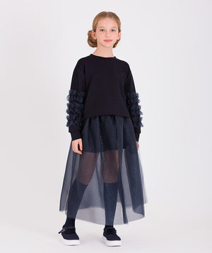 Girls' navy blue tulle skirt paired with a navy top featuring ruffle details on the sleeves