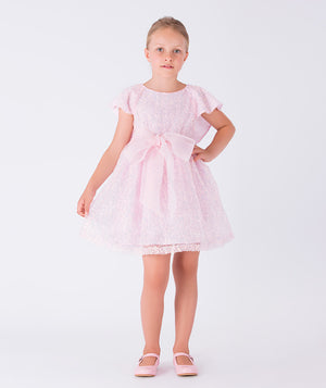 pink sequined dress with a bow on the waist