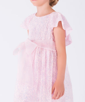 shimmering pink dress with an organza bow on the waist