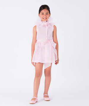 pink blouse with organza ruffled neckline and shimmering skirt with an organza bow on the waist