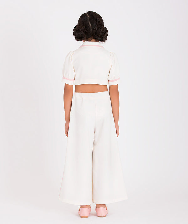 a white wide-leg pants outfit paired with a cropped jacket