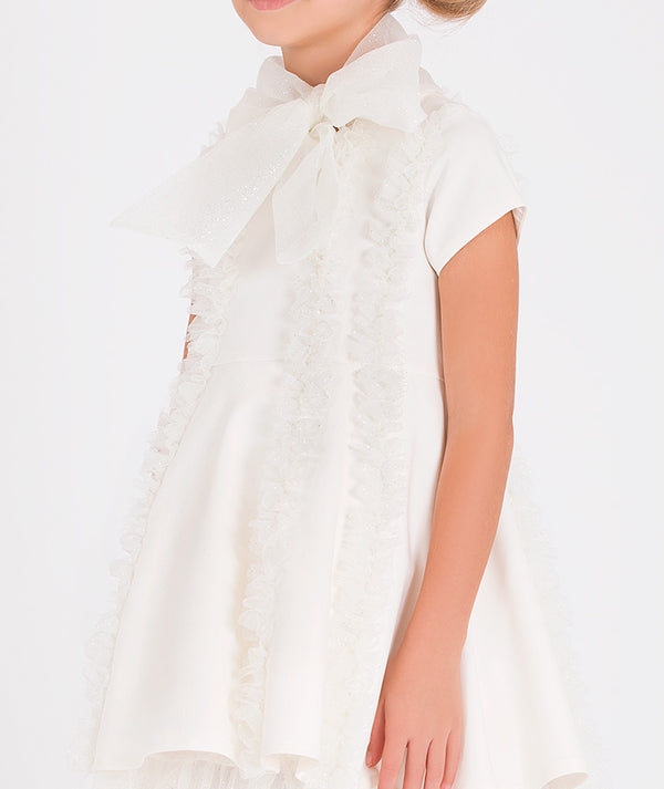 Elegant white dress for girls featuring a bow tie collar and frilled layers