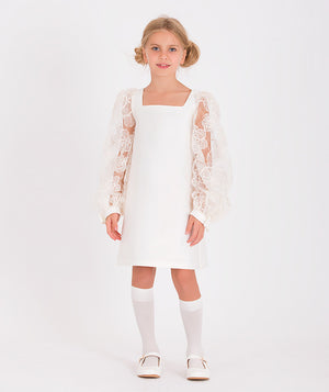 a white square-neck dress with long sheer floral lace sleeves