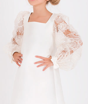 Elegant girl's dress featuring floral lace balloon sleeves and a sleek, minimalist design