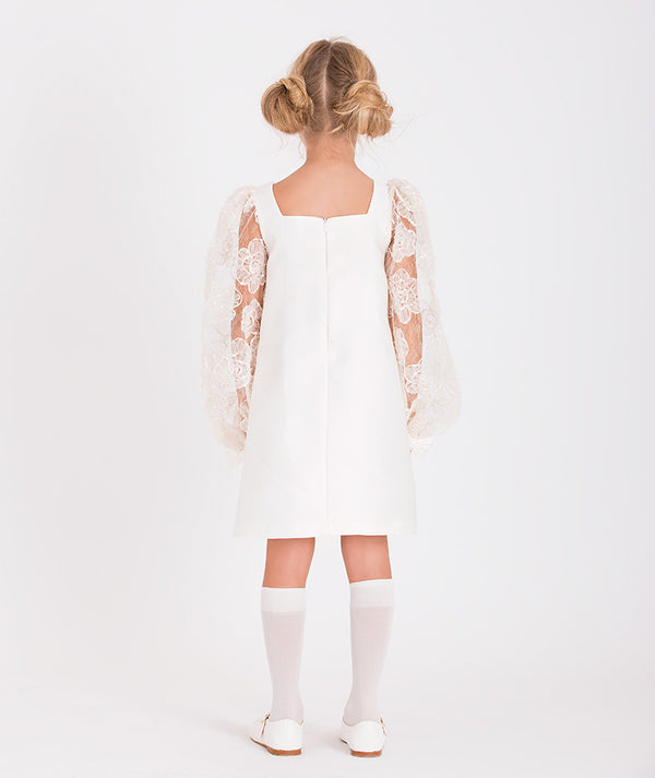 White dress with floral lace sleeves and a square neckline