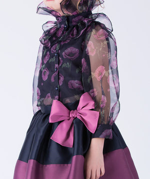 Elegant navy organza blouse with sheer sleeves and ruffled collar, paired with a puff skirt trimmed in purple and a mulberry bow waist detail.