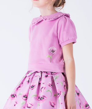 Lilac blouse with a ruffled Peter Pan collar and delicate orchid print, paired with a matching orchid-printed skirt