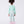 Load image into Gallery viewer, Child wearing a light green outfit with floral pants on a white background
