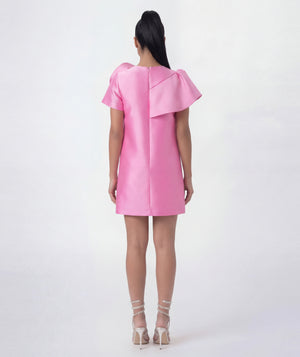 Pink dress with ruffled sleeves on a white background