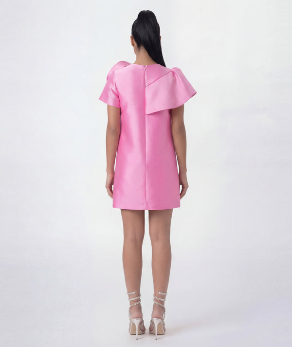 Pink dress with ruffled sleeves on a white background