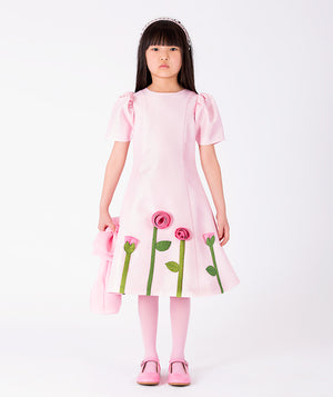 Front view of 3D Rose Appliqué Girls Dress in blush pink structured matte satin for girls ages 3 to 12, showing overall silhouette and styling