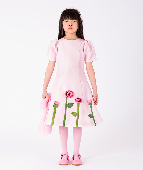 Front view of 3D Rose Appliqué Girls Dress in blush pink structured matte satin for girls ages 3 to 12, showing overall silhouette and styling